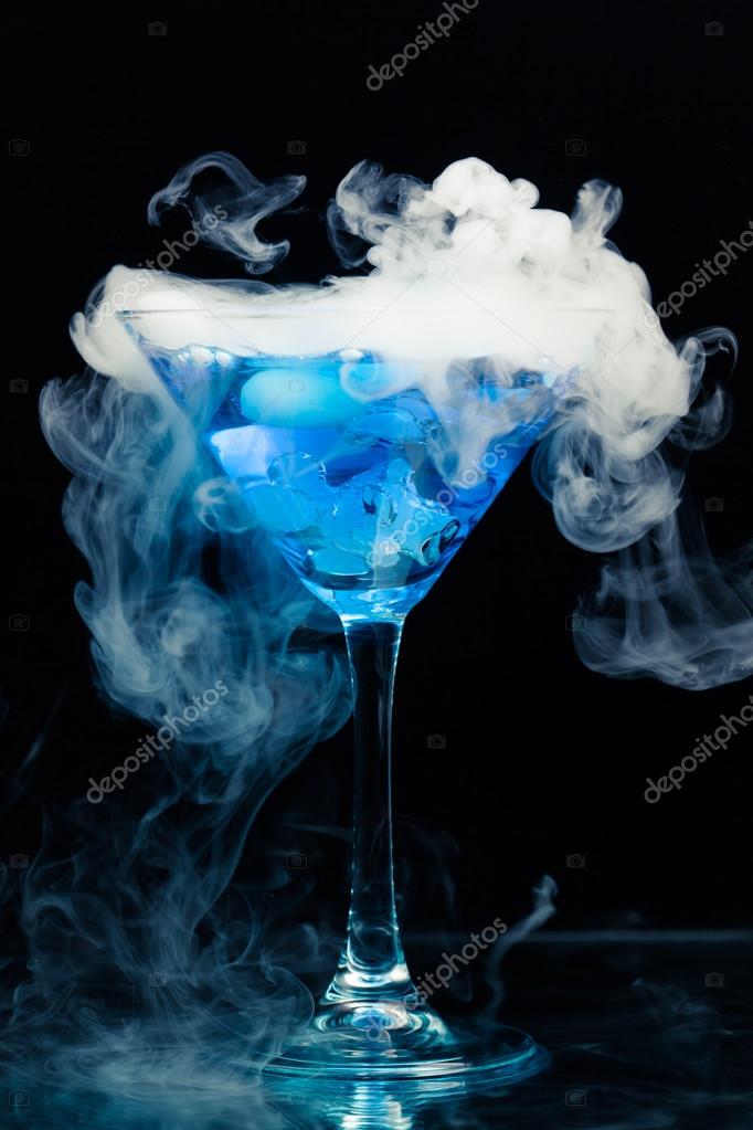 Blue cocktail with splash and ice vapor Stock Photo by ©nikkytok 34666633