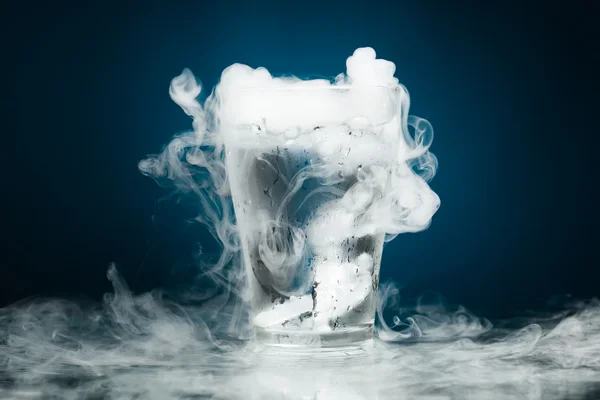 Glass of water with ice vapor — Stock Photo, Image