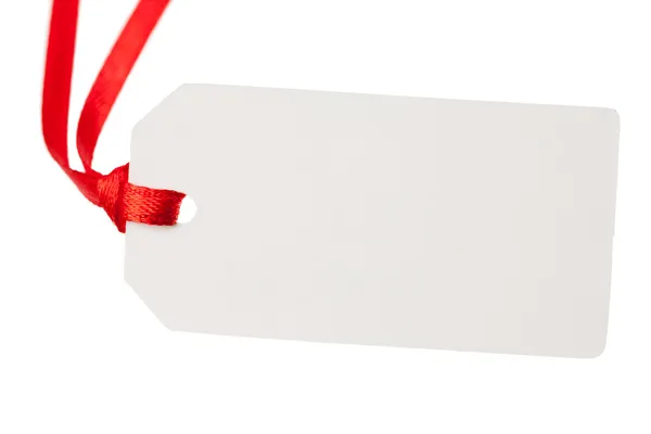 Blank gift tag with red ribbon — Stock Photo, Image