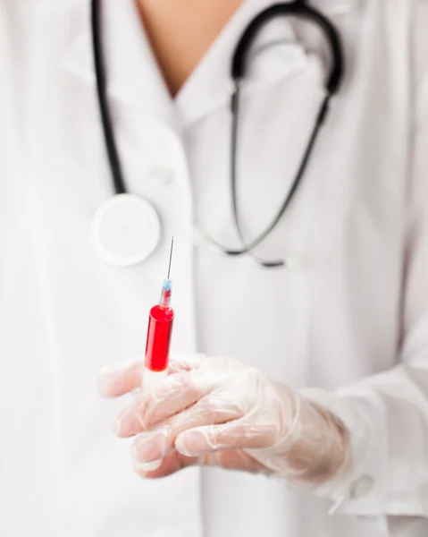 Syringe in doctor's hand — Stock Photo, Image