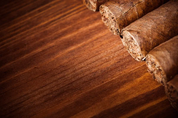 Cigars on wooden background — Stock Photo, Image