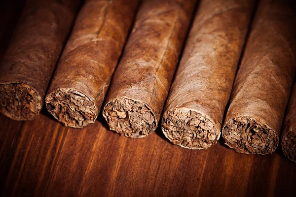 Cigars on wooden background — Stock Photo, Image