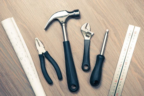 Tools against wooden background — Stock Photo, Image