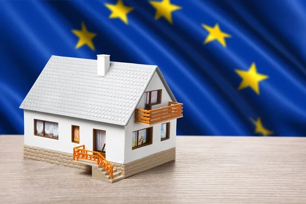 Classic house against EU flag background — Stock Photo, Image