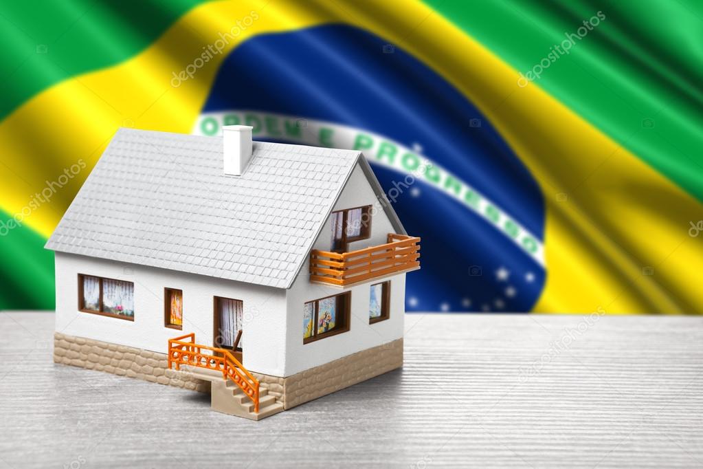 classic house against Brazilian flag background