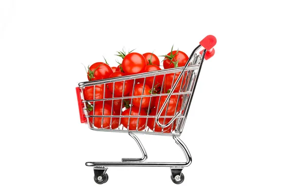 Carrinho de compras com tomates, isolado em branco — Fotografia de Stock