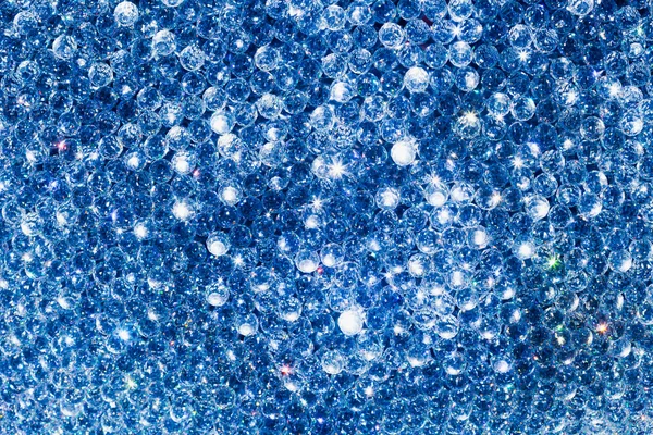 ダイヤモンドの多数と抽象的な青い背景 — ストック写真