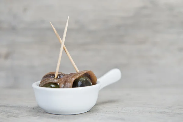 Snack made of anchovies and olives — Stock Photo, Image