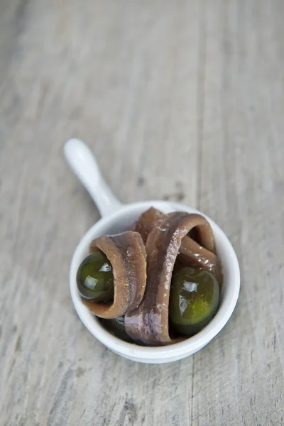 Snack made of anchovies and olives — Stock Photo, Image