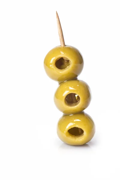 Drie olijven op een tandenstoker — Stockfoto