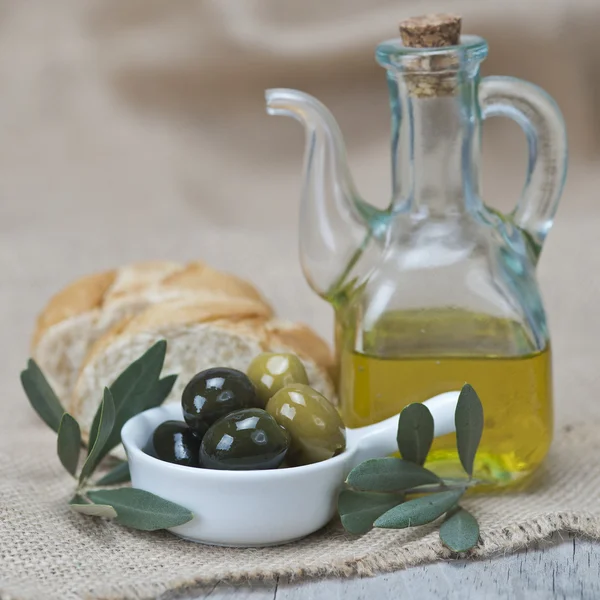 Olive oil with olives and bread — Stock Photo, Image