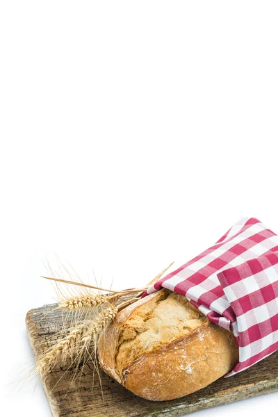 Wheat bread on a cuttig board — Stock Photo, Image