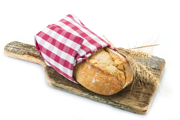 Wheat bread on a cuttig board — Stock Photo, Image