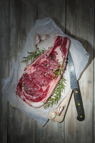 Steak over a wooden background