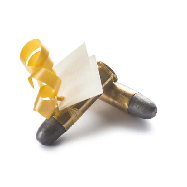 Bullets with a card decorated like a gift — Stock Photo, Image