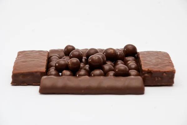 Barras de chocolate e bolas de chocolate — Fotografia de Stock