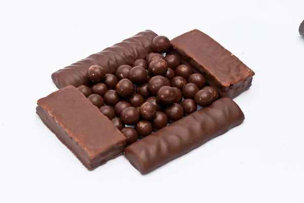 Barras de chocolate e bolas de chocolate — Fotografia de Stock