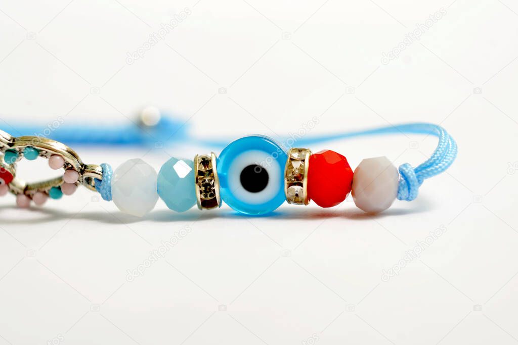 Evil eye children summer bracelet . Mediterranean people believed that evil eye keeps evil things away. Isolated on the white background