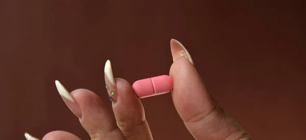 Female Hand Holds Fingers Medicine Pill Capsule — стоковое фото