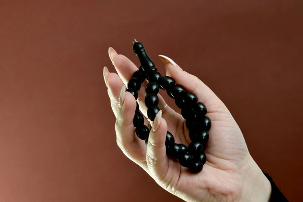 Woman Hand Hodling Black Prayer Beads Royalty Free Stock Images