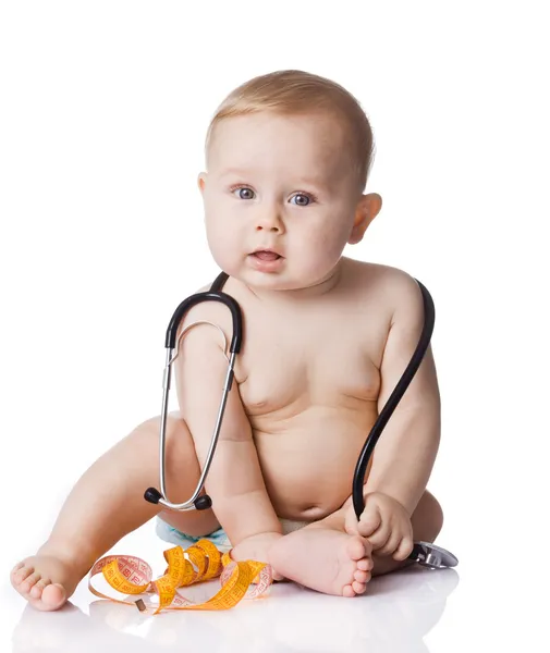 Sweet baby with stethoscope and measure tape on a white backgrou Stock Image