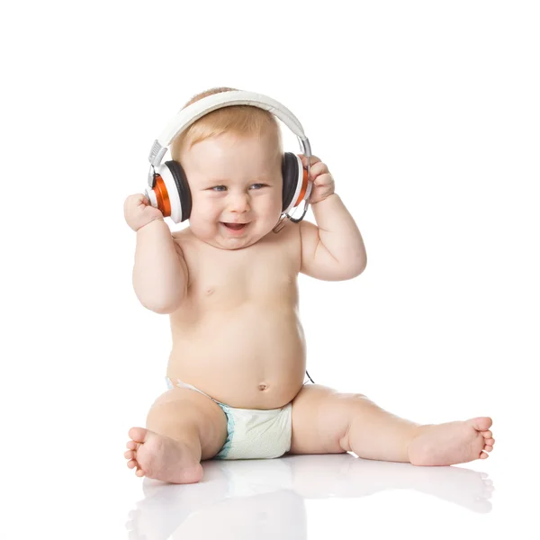 Dítě se sluchátkem. mladý DJ Stock Snímky