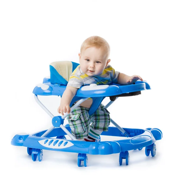 Little baby in the baby walker. Royalty Free Stock Images