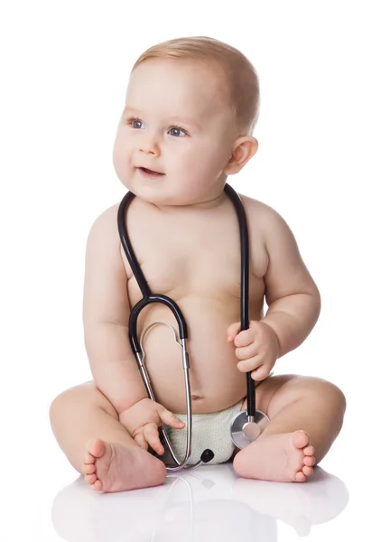 Sweet baby with stethoscope on a white background. Adorable baby Stock Photo
