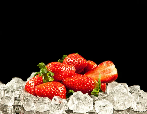 Strawberry on black background. strawberries with ice cubes on — Stock Photo, Image