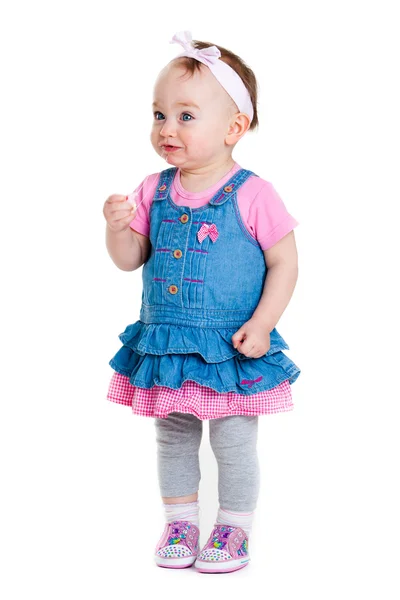 Baby in een roze jurk. geïsoleerd op witte achtergrond. — Stockfoto