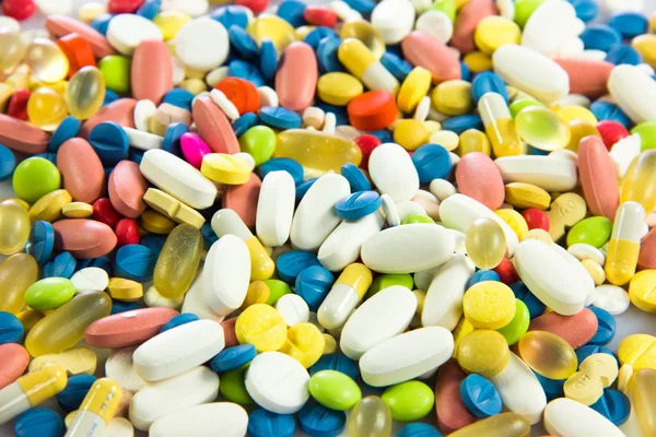 Fond fait de pilules colorées. — Photo