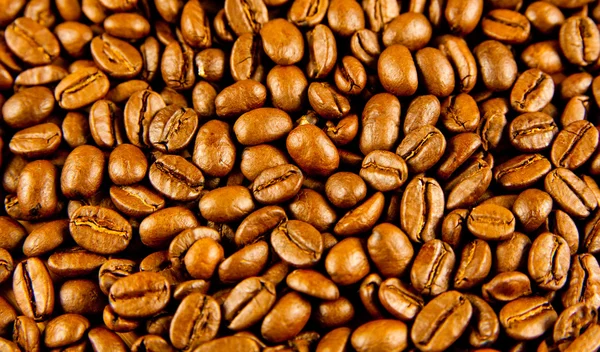 Café brun, texture de fond. grains de café torréfiés. Brown co — Photo