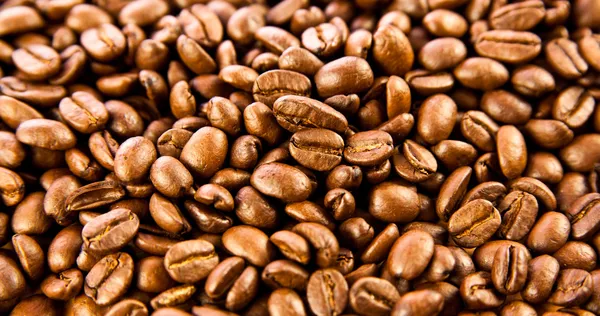 Café brun, texture de fond. grains de café torréfiés. Brown co — Photo