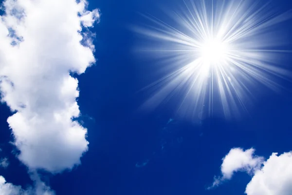 Blue sky with clouds and sun. White clouds in blue sky — Stock Photo, Image