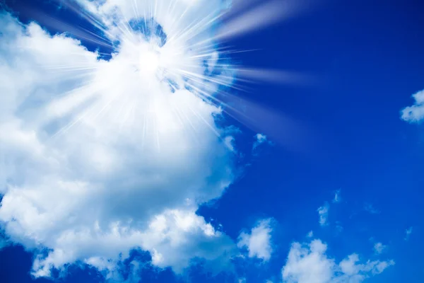 Blue sky with clouds and sun. White clouds in blue sky — Stock Photo, Image