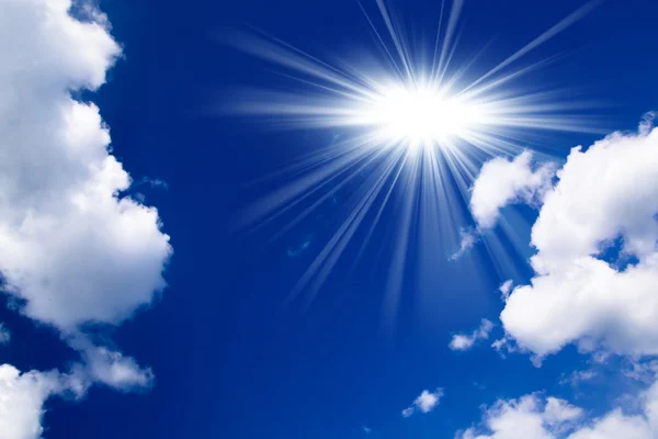 Blue sky with clouds and sun. White clouds in blue sky — Stock Photo, Image