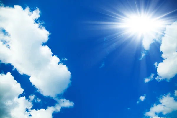 Blue sky with clouds and sun. White clouds in blue sky — Stock Photo, Image