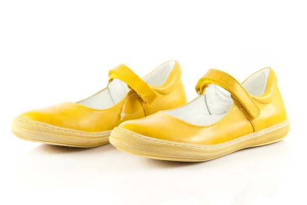 Children's shoes isolated over the white background. yellow sh — Stok fotoğraf