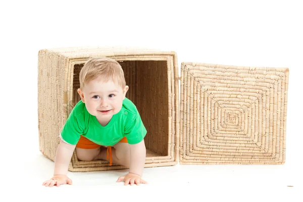 Little boy inside a box on a white background Stock Photo