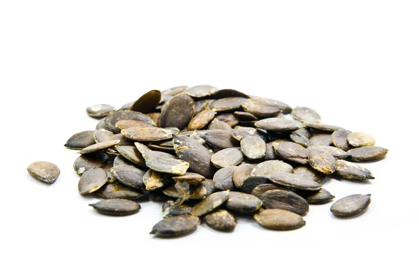 Pumpkin seeds on a white background — Stock Photo, Image