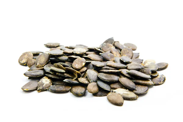 Beyaz arkaplanda kabak tohumları — Stok fotoğraf
