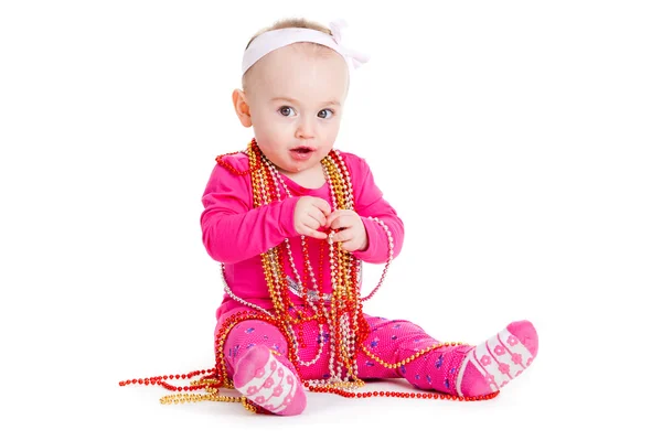 Baby flicka som leker med pärlor. — Stockfoto