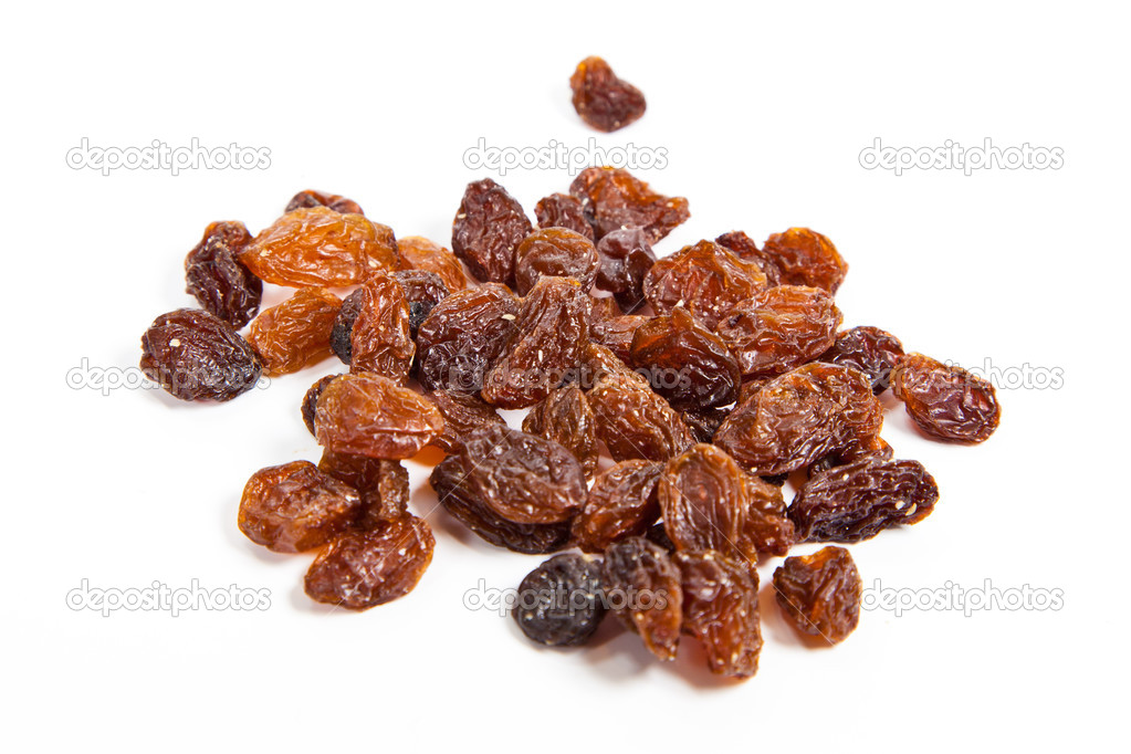 brown raisins on a white background
