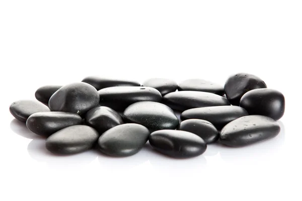 Czarny Masaż kamieniami na białym tle. — Zdjęcie stockowe