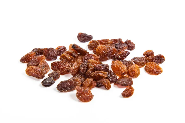 Brown raisins on a white background — Stock Photo, Image