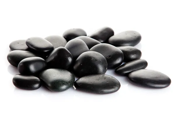 Piedras de masaje negro aislado . — Foto de Stock