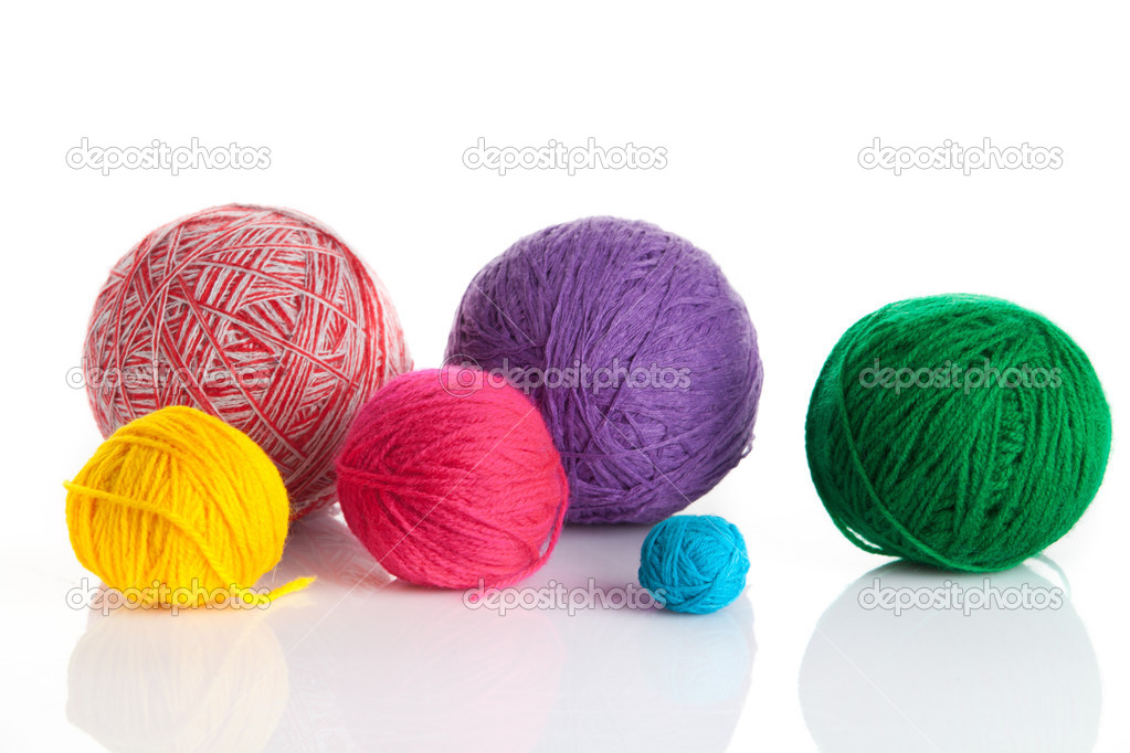 Colorful different thread balls. wool knitting on white background