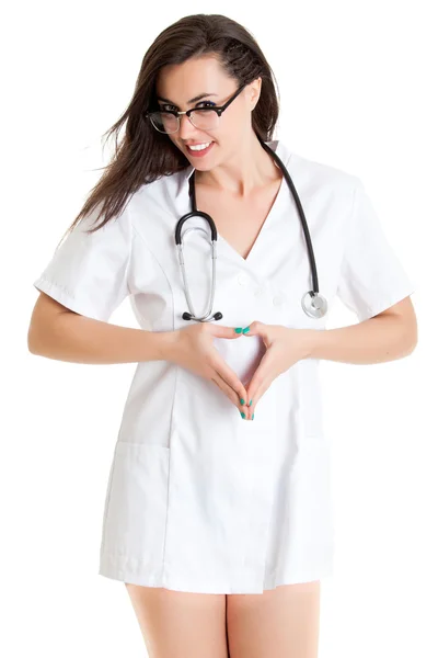 Female doctor make a heart with her hands. — Stock Photo, Image