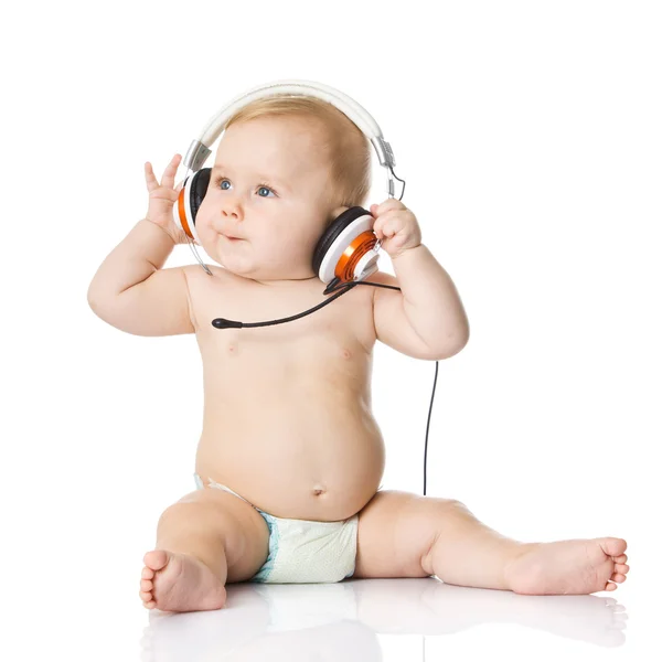 Baby with headphones. Stock Photo