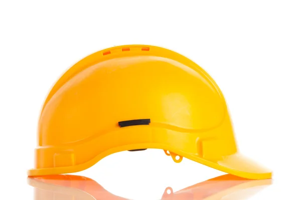 Casque de sécurité jaune sur fond blanc. — Photo